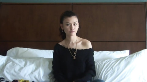 Asian Girl Trying On Tops